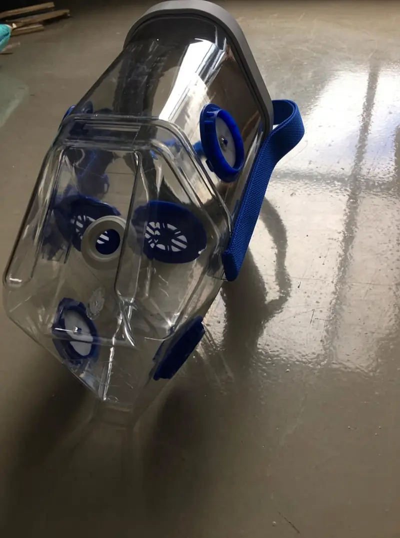 Close view of the clear Horse Neb mask and blue one-way valves
